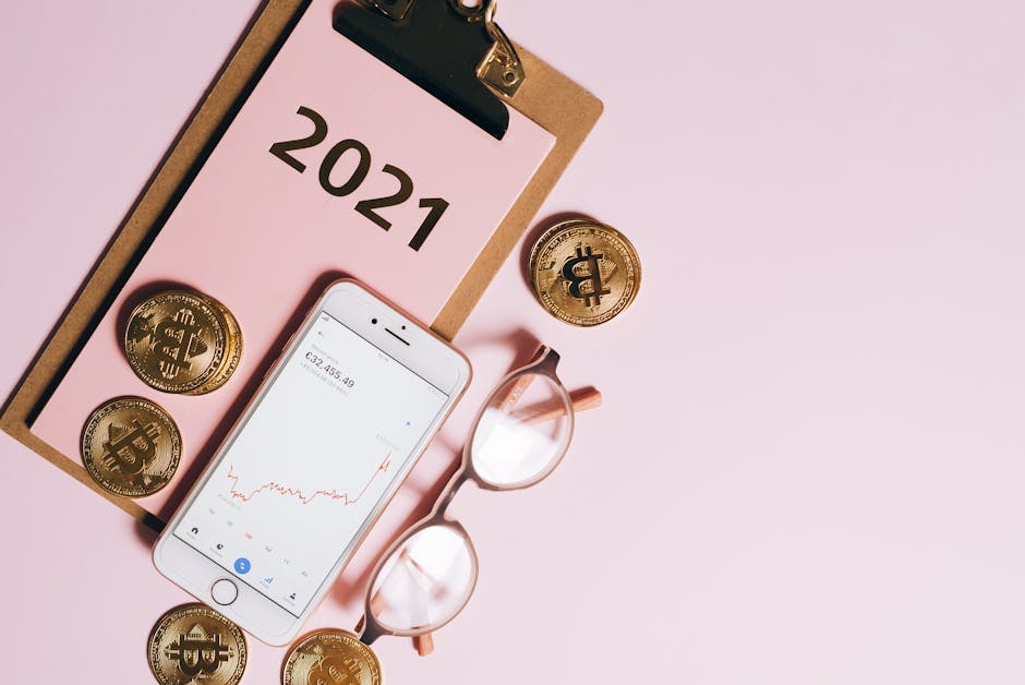 Visual representation of cryptocurrency trends with coins, smartphone, and financial charts on a clipboard.