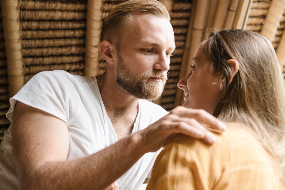 A tender moment between a couple indoors, capturing affection and connection.