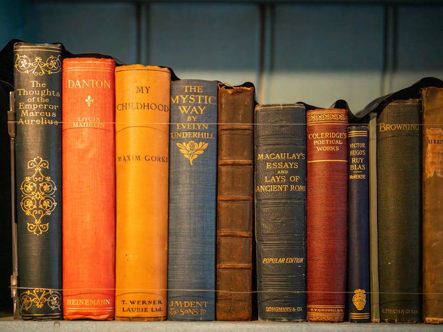 A row of vintage hardcover books with elegant bindings and classic literature titles.
